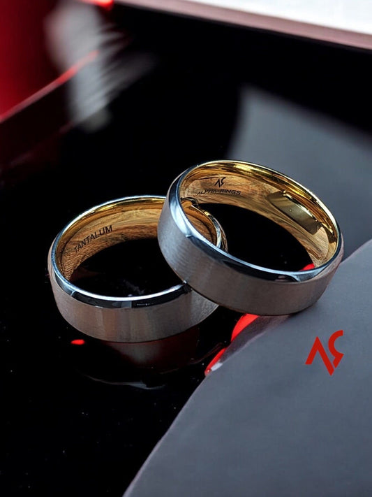 Comfort-fit men's wedding band on a man's hand gripping a steering wheel